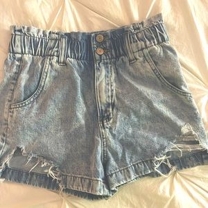 High waisted cinched wait band, semi ripped on front